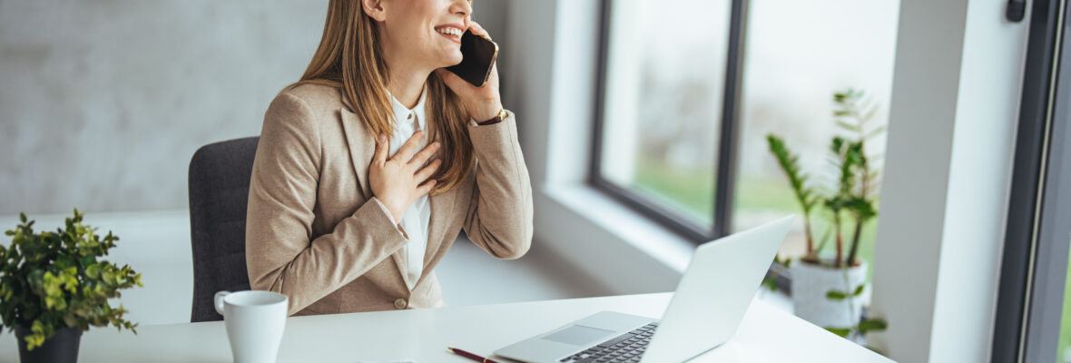 Portrait young business woman talk on smartphone write notebook laptop in home office. Beautiful girl at desk computer take home order. Startup business  woman online sme telemarketing