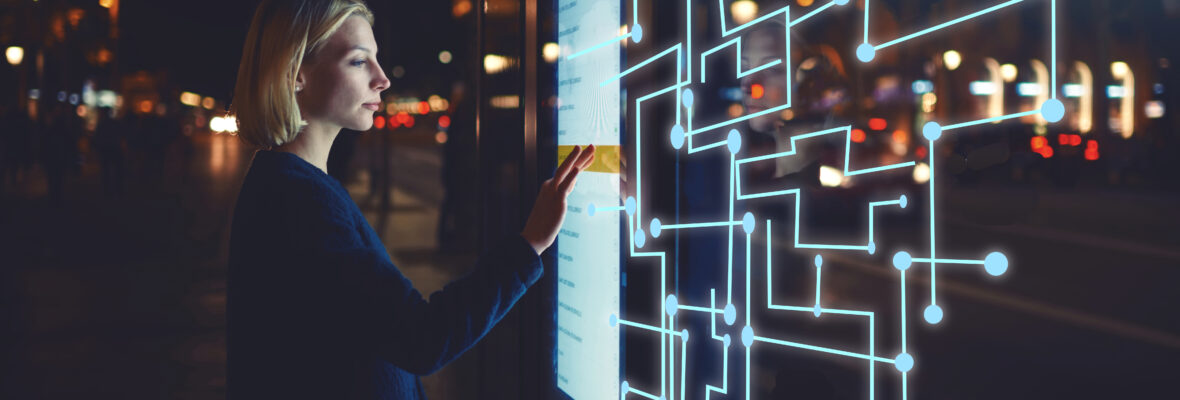 Young woman touching sensitive screen while selecting surface op