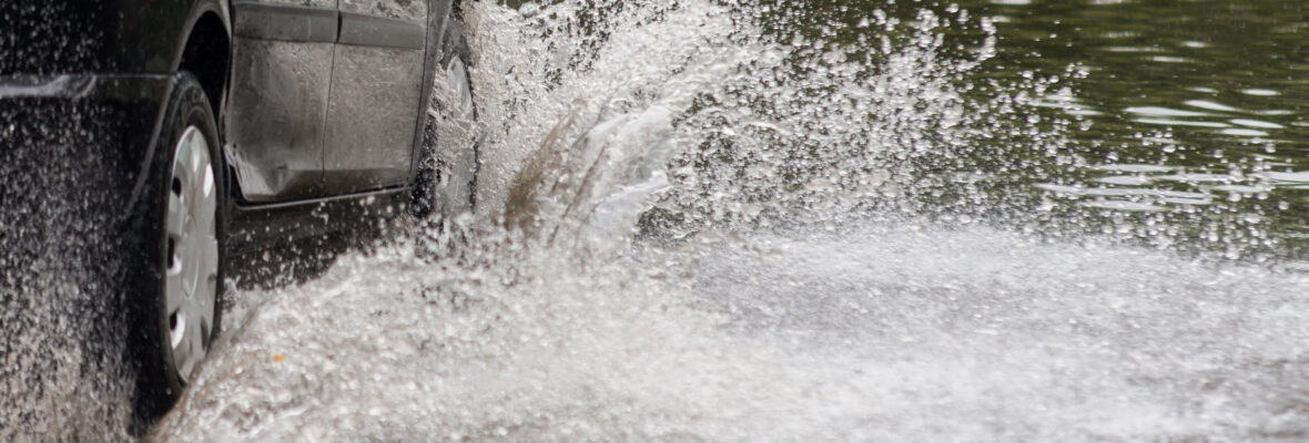 car in water after heavy rain and flood