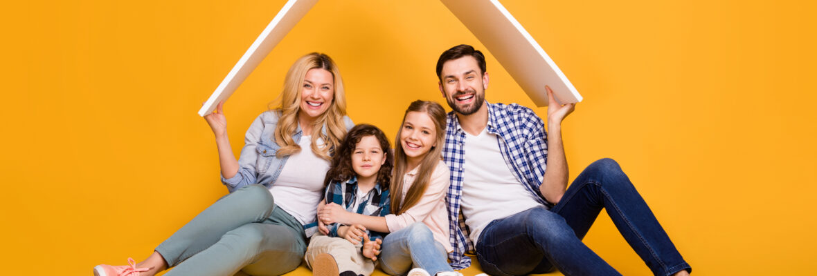 Photo offspring mommy daddy daughter small son happy together four member family support care hold hands roof above their head moving big dream house isolated yellow color background